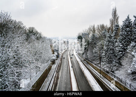 Looking South along Archway Road, North London, in the snow, from Hornsey Lane bridge, Lonon, UK Stock Photo