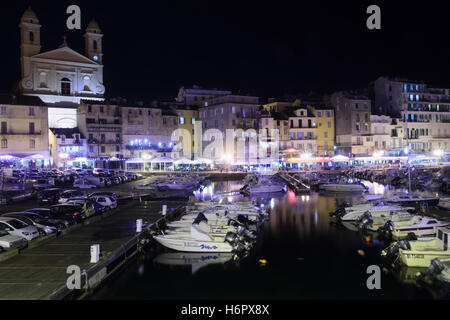 BASTIA, FRANCE - OCTOBER 15, 2014: Scene of the old port (the Vieux Port) at night, in Bastia, Corsica, France. Bastia is the bi Stock Photo