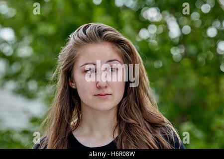 Sad lonely young woman on the verge of crying Stock Photo