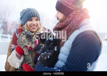 Cat lovers during winter walk Stock Photo