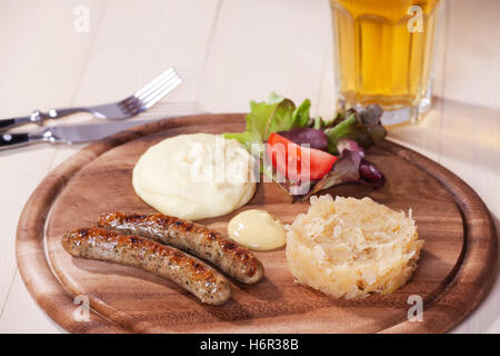 two sausages on a wooden board Stock Photo