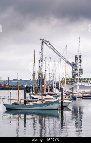 Boats and ships moored in Port Pendennis Marina with Falmouth Docks in the background, Cornwall. Stock Photo