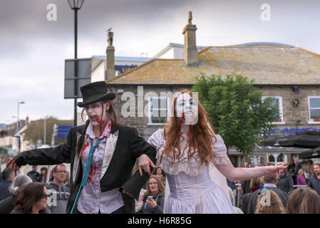 Zombies.  Families and children gather for the annual Zombie Crawl in Newquay, Cornwall. Stock Photo