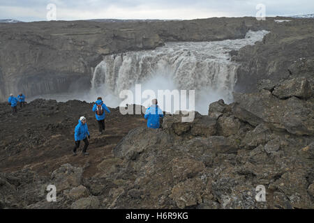 Tourists at Aldeyjarfoss, central Iceland. Stock Photo