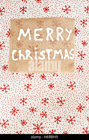 parchment with an inscription on the textile background Christmas. Stock Photo