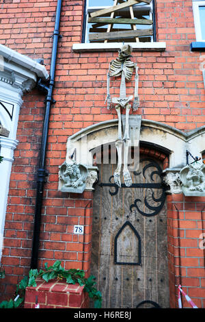 Haunted house skeleton hanging above door entrance scary to scare away visitors Halloween decoration decorations Louth, UK. Louth, UK. 31st October, 2016. England haunted house dare to enter scary place to visit Credit:  Tommy  (Louth)/Alamy Live News Stock Photo