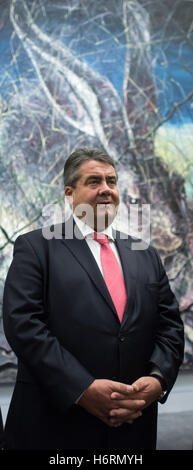 German Federal Finance Minister Sigmar Gabriel Gabriel is received by the Chinese artist Zeng Fanzhi and shown his work in his exhibition at the Ullens Center for Contemporary Art (UCCA) in Beijing, China, 1 November 2016. Gabriel and a large trade delegation are visiting China and Hongkong until Saturday, the 5 November 2016. Photo: Bernd von Jutrczenka/dpa Stock Photo
