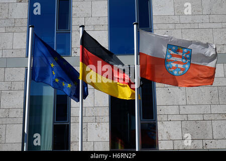 Berlin, Germany. 21st Apr, 2016. The Flags of the European Union, Germany and the federal state of Thuringia wave in front of the Federal Delegation for the Free State of Thuringia on Mohrenstrasse in Berlin-Mitte. Taken on 21.04.2016. Photo: S. Steinach - NO WIRE SERVICE - | usage worldwide/dpa/Alamy Live News Stock Photo