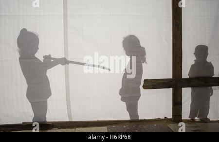 October 31, 2016 - Beit Hanoun, The Gaza Strip, Palestine - The shadow of Palestinian kid living at caravan shelter in the city of Beit Hanoun, northern the Gaza Strip since the 51 day Gaza war (Credit Image: © Mahmoud Issa/Quds Net News via ZUMA Wire) Stock Photo