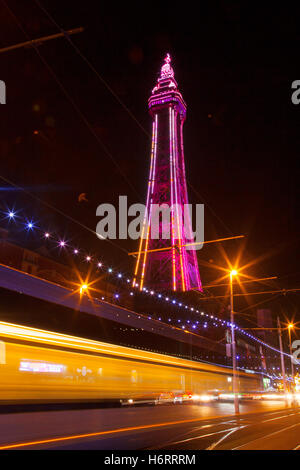 Blackpool Tower & passing traffic trails at night, Lancashire, UK. Lightpool Festival illuminations in Blackpool town centre has been transformed with more than 30 installations and sculptures, as the first Lightpool Festival gets under way in the resort.
