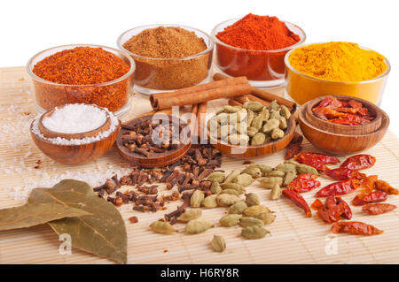 leaves boil cooks boiling cooking bay paprika peppers spices coriander chilli chili herbs foliage some several a few glass Stock Photo