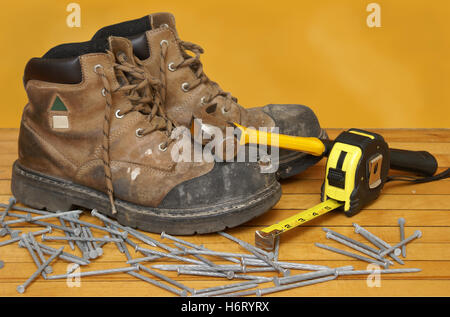 boot danger career hand tool tools job industry industrial antique rough guard vintage leather accident foot toe steel work Stock Photo