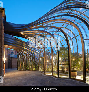 Curved greenhouse structures forming archway. Bombay Sapphire ...