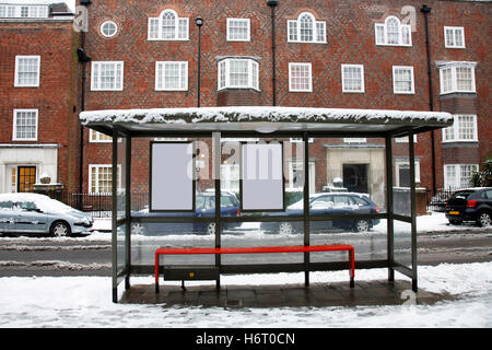 city town winter snow coke cocaine material drug anaesthetic addictive drug bus stop transport london stop morning empty stops Stock Photo