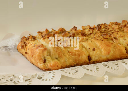 Puff pastry and chocolate pieces with nuts over. Stock Photo