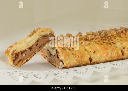 Puff pastry and chocolate pieces with nuts over. Stock Photo