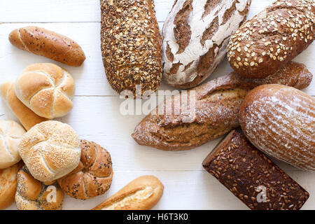 Many mixed breads and rolls shot from above. Stock Photo