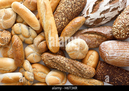 Many mixed breads and rolls shot from above. Stock Photo