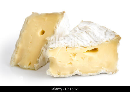 Two pieces of cut white mould cheese isolated on white. Stock Photo