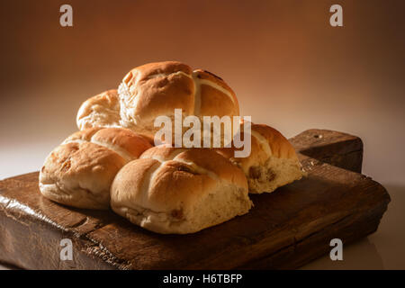 Stack of hot cross buns for Easter with ceative lighting Stock Photo