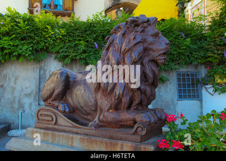 Lion, metal, plinth, old, ornate, travel, vintage, weathered, style, shaped, patina, rusty, hardware, antique, hardware gate guard, entrance, roar. Stock Photo