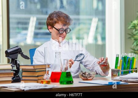 Young crazy chemist working in the lab Stock Photo