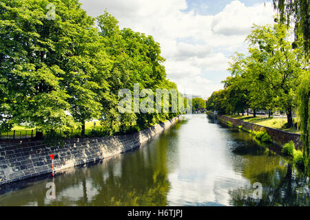 Dreamy view of Spree river in Berlin. Trees and shadows create dramatic atmosphere. Stock Photo