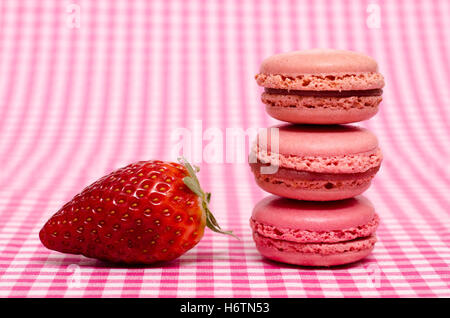 strawberry and three macaron in red Stock Photo