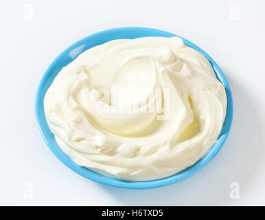 blue food aliment closeup spread plate cream smooth dairy whipped cream milk product ingredient dessert white bowl cream cheese Stock Photo