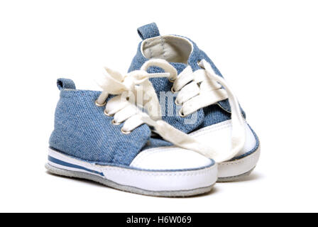 blue isolated fashion closeup new shoes youth small tiny little short baby foot feet shoelace details boys clothing canvas