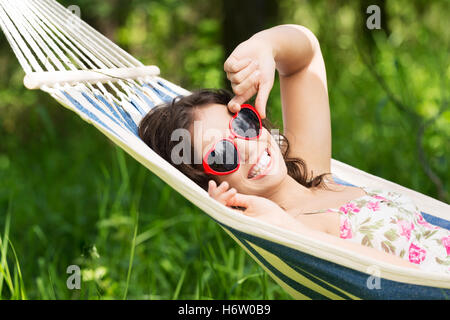 young woman lying in a hammock Stock Photo