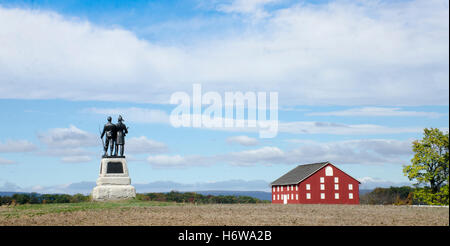 Monument to the 73rd New York Infantry in Excelsior Field in the Gettysburg Peach Orchard. Red Pennsylvania barn is at right. Stock Photo