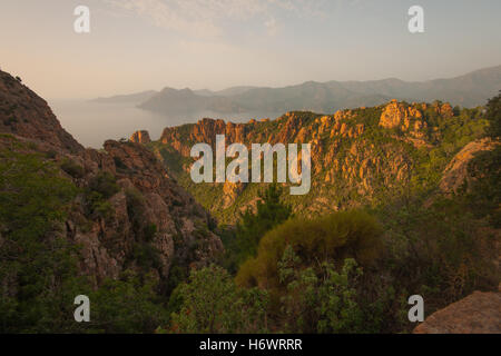 The cliffs of the Calanques de Piana at sunset, in Corsica, France Stock Photo