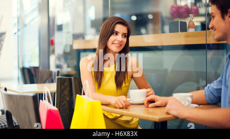 woman talk speaking speaks spoken speak talking chat nattering cafe restaurant humans human beings people folk persons human Stock Photo