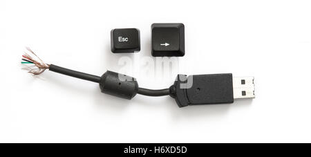 Escape key, right arrow key and cut off USB cable Stock Photo