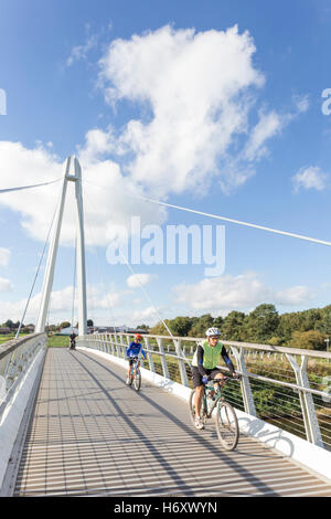 Cycling over Diglis Bridge the new pedestrian and cycling River Severn crossing, Worcester,  Worcestershire, England, UK Stock Photo