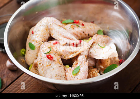 Raw marinated chicken wings prepared in Asian style with honey, garlic, soy sauce and herbs Stock Photo