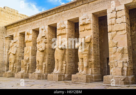 The ruins of the Ramessid columns in the peristyle court of Habu Temple (Ramesses III Temple), Luxor, Egypt. Stock Photo