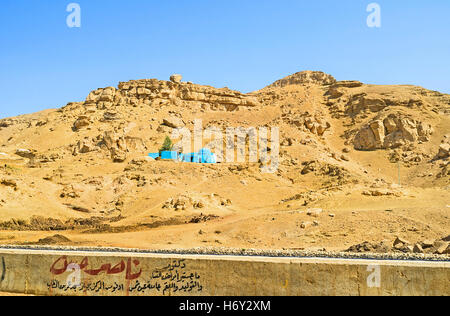 The lonely blue mosque on the desert hill in Esna suburb, Upper Egypt. Stock Photo