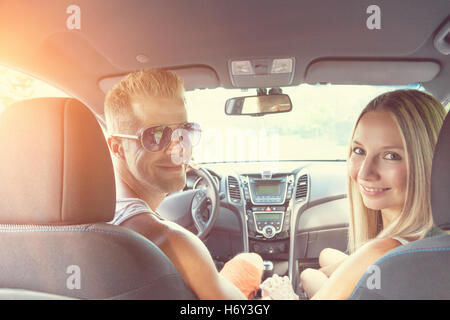Young happy people enjoying a roadtrip in the car Stock Photo