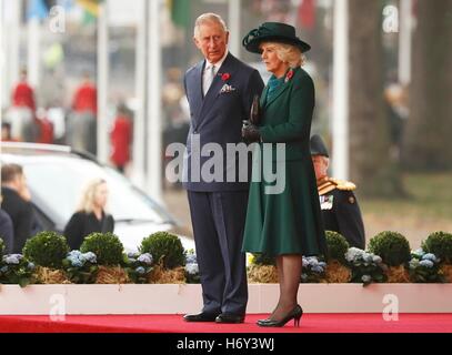 The Prince of Wales and the Duchess of Cornwall during the ceremonial welcome for Colombia's president Juan Manuel Santos, and his wife, Maria Clemencia Rodriguez de Santos, on London's Horse Guards Parade at the start of his official state visit to the UK. Stock Photo