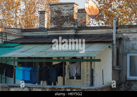 Belgrade, Serbia - November 1st, 2016: clothes drying on a line in a covered balcony Stock Photo