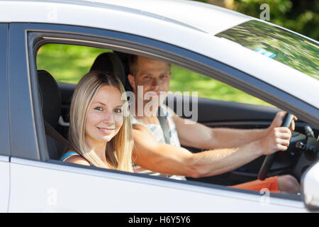 Young happy people enjoying a roadtrip in the car Stock Photo