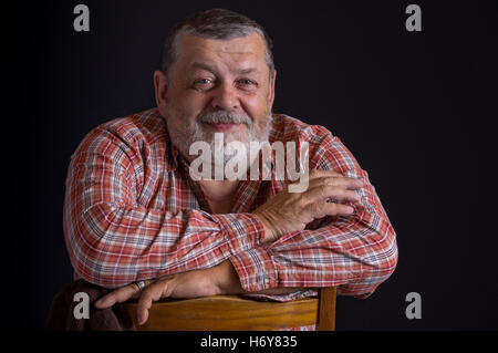 Portrait of happy Ukrainian peasant wearing checked shirt Stock Photo