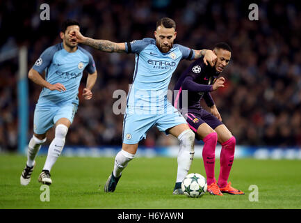 Manchester City's Nicolas Otamendi (left) and Barcelona's Neymar battle for the ball during the UEFA Champions League match at the Etihad Stadium, Manchester. Stock Photo