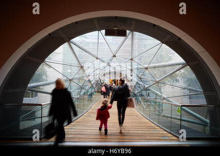 Manchester glass walkway Arndale connect   Shoppers walk through glass tunnel connecting Manchester Arndale centre  Marks Spence Stock Photo