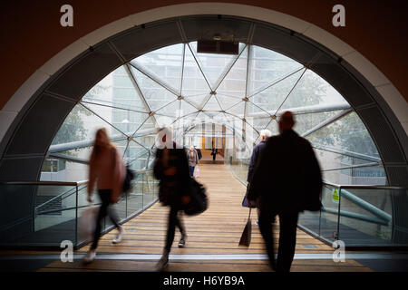 Manchester glass walkway Arndale connect   Shoppers walk through glass tunnel connecting Manchester Arndale centre  Marks Spence Stock Photo