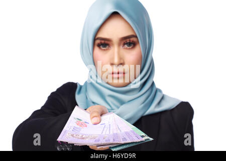 a photo of woman holding a bribery money isolated in white background Stock Photo