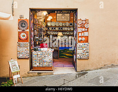 SIENA, ITALY - JUNE 29, 2013: Traditional art and souvenir shop in old town of Siena, Italy in a territory of Contrade Snail. Stock Photo