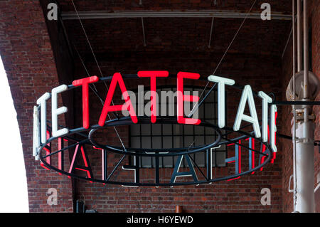 Tate sign outside the gallery in the Albert Dock, Liverpool. Stock Photo